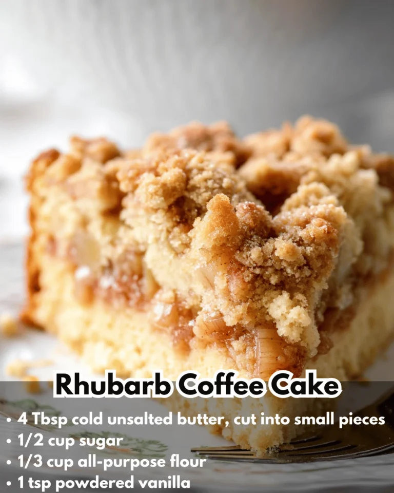 A slice of rhubarb coffee cake on a plate with coffee in the background