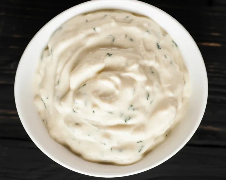 Delicious Domino's Garlic Parmesan Sauce - a perfect creamy addition to your pizza.