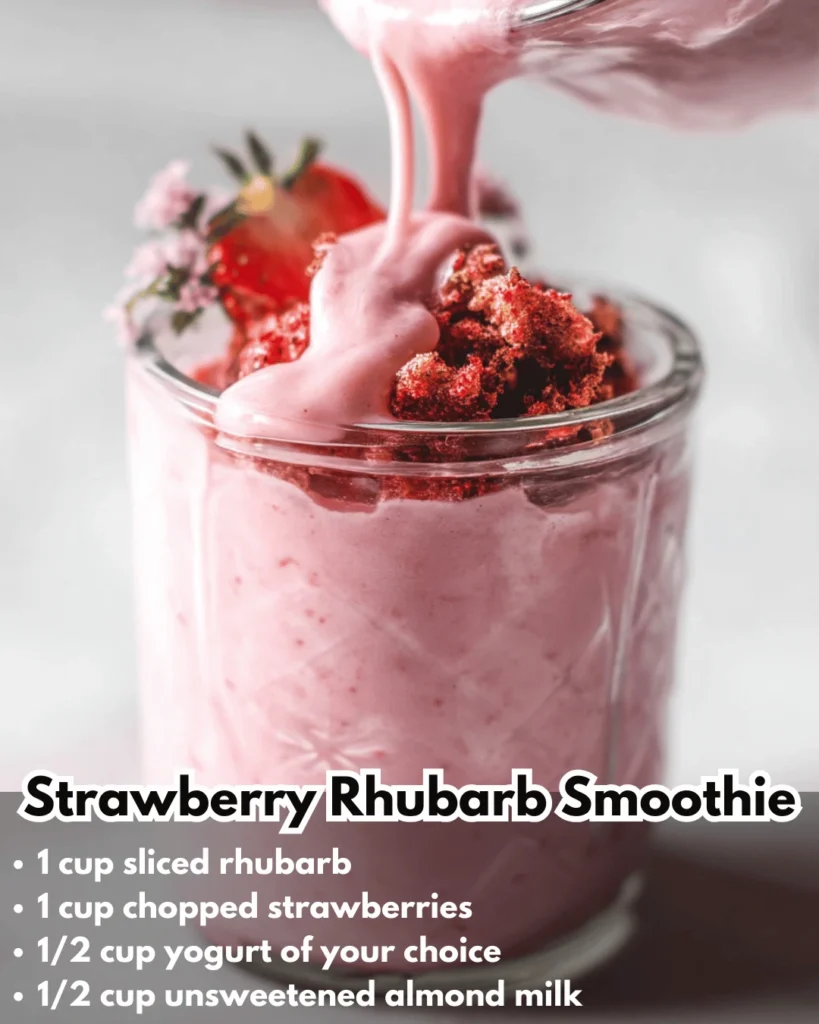 Delicious strawberry rhubarb smoothie in a glass garnished with fresh strawberries.