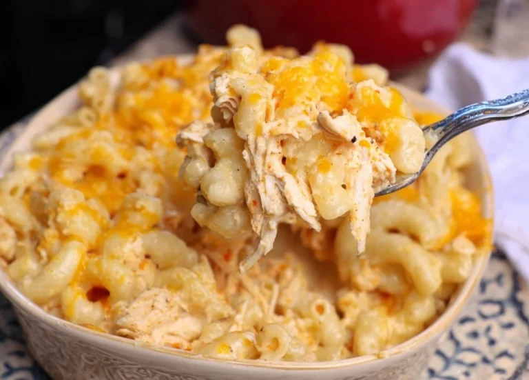 Creamy Buffalo Chicken Mac and Cheese topped with spicy sauce and fresh herbs