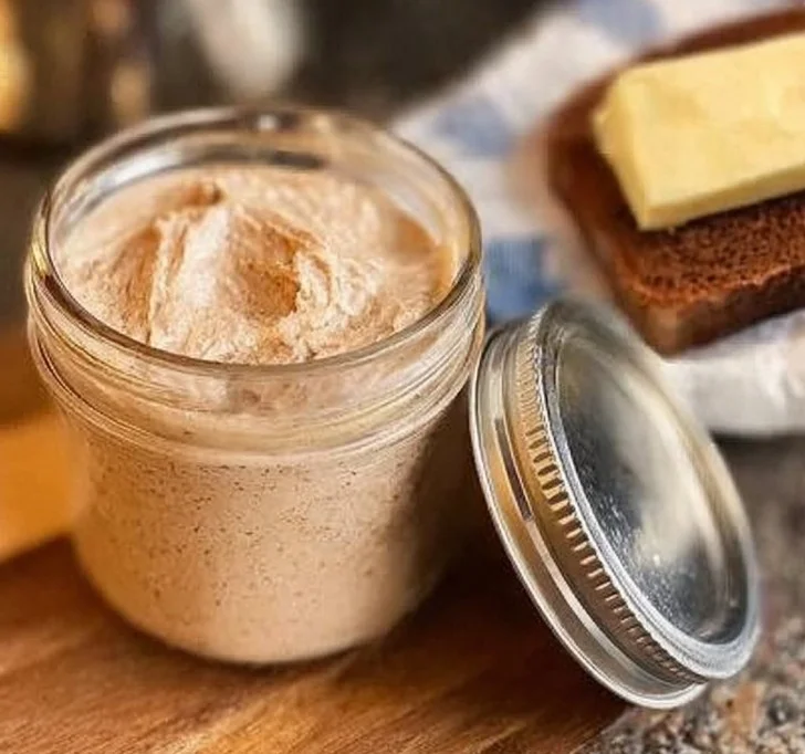 Delicious homemade cinnamon butter in a bowl with a spoon.
