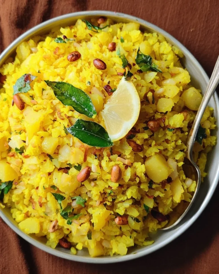 Delicious Kanda Poha dish served in a bowl with garnishes