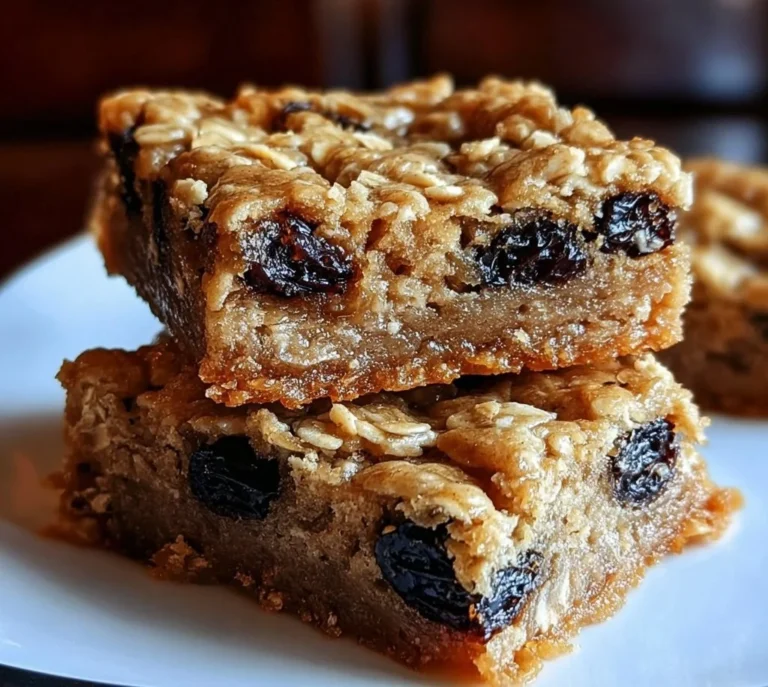 Freshly baked oatmeal raisin cookie bars on a serving platter