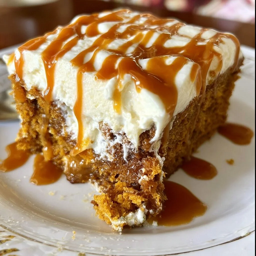 Delicious pumpkin cake with salted caramel and cream cheese frosting on a plate