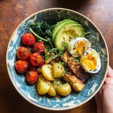 Savory vegan breakfast bowl filled with colorful vegetables and grains