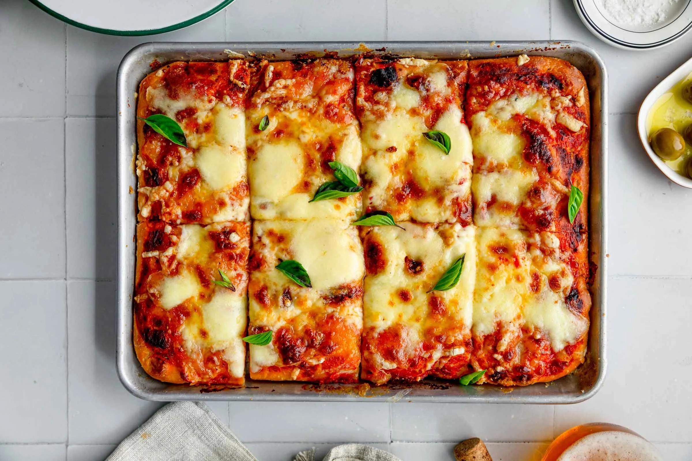 Delicious homemade sheet pan pizza topped with fresh ingredients.