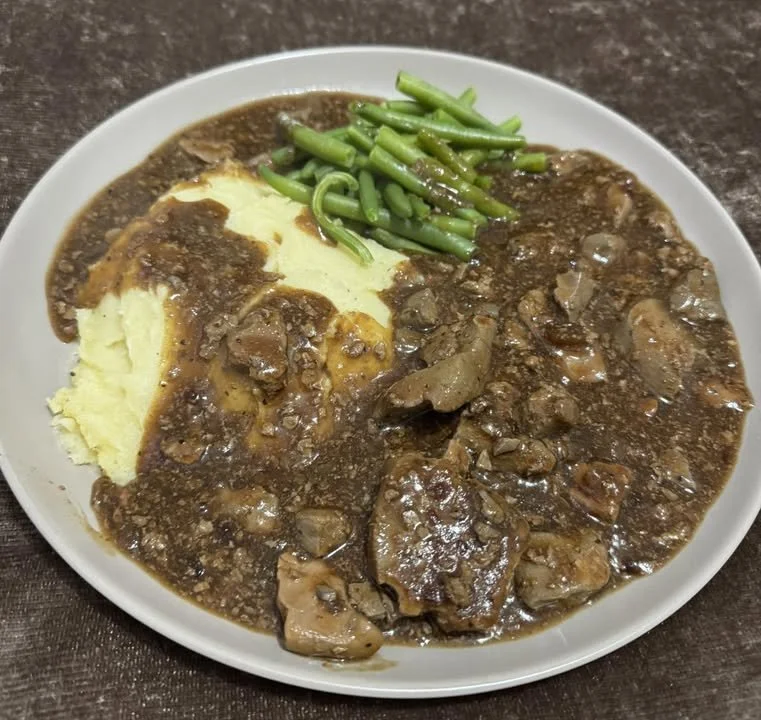 Savory liver mash served with creamy mashed potatoes and tender green beans.