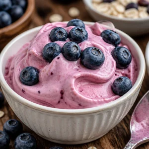 Delicious homemade frozen Greek yogurt topped with fresh fruit