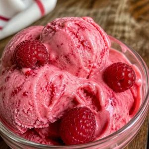 Raspberry Blender Frozen Yogurt served in a bowl with fresh raspberries on top