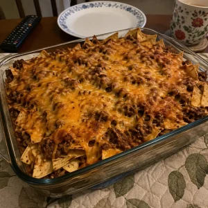 Delicious Loaded Beef Nacho Casserole topped with cheese and jalapenos